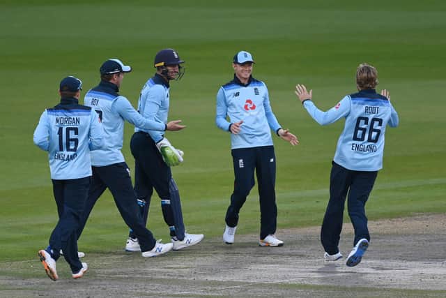 England's Sam Billings (2nd R) celebrates after running out Australia's Marnus Labuschagne at Old Trafford. (