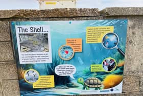 A new sign advertising the recycling bin
