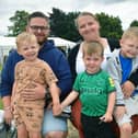 Bailey Andrew and Britany Millar with (from left) Hudson Andrew, four, Grayson Dunn, two, and Oakley Andrew, six, of Boston.