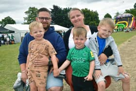 Bailey Andrew and Britany Millar with (from left) Hudson Andrew, four, Grayson Dunn, two, and Oakley Andrew, six, of Boston.