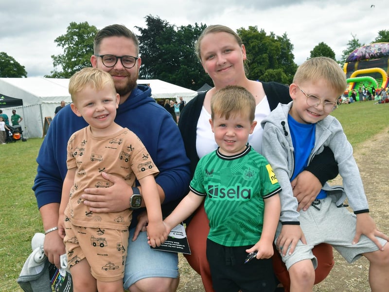 Bailey Andrew and Britany Millar with (from left) Hudson Andrew, four, Grayson Dunn, two, and Oakley Andrew, six, of Boston.