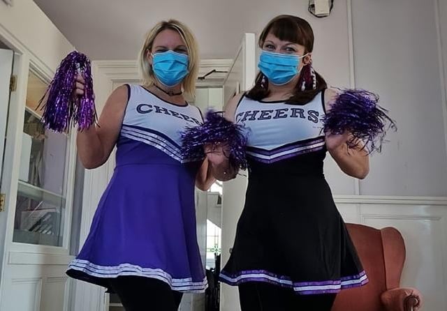 Manager Hayley Peace and care home co-ordinator ready for a spot of cheerleading.