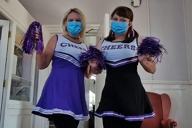 Manager Hayley Peace and care home co-ordinator ready for a spot of cheerleading.