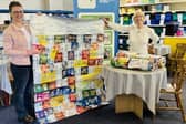 William Alvey School is holding a community event to make 'bivvy' blankets out of used crisp packets for homeless people. Left – teaching assistant Sam McKenna with a representative of Grantham Food Bank.