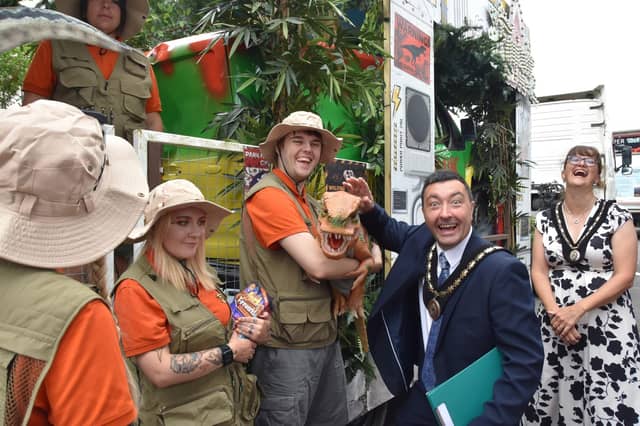 Roaring success - Mayor of Skegness Coun Jimmy Brookes at the Jurassic Park themed float from Fantasy Island which won the trade category. Photo: Barry Robinson.