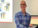 Andrew being presented with his award.