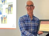 Andrew being presented with his award.