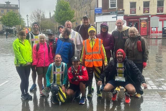 Some of the Boston runners in the early rain.