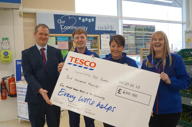 Executive headteacher Andrew Smith collected the donation from Tesco's Kai Brown Rachael Bell and Jackie Allnutt
