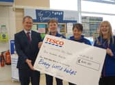 Executive headteacher Andrew Smith collected the donation from Tesco's Kai Brown Rachael Bell and Jackie Allnutt