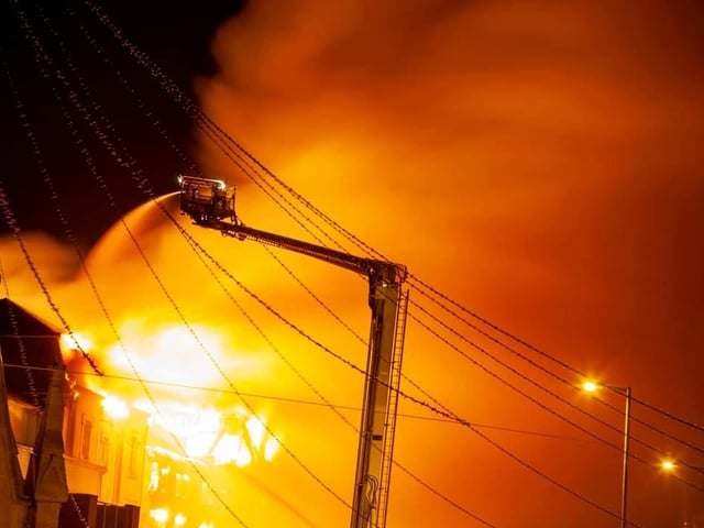 Onlookers who had been evacuated couldn't believe how quickly the fire spread.
