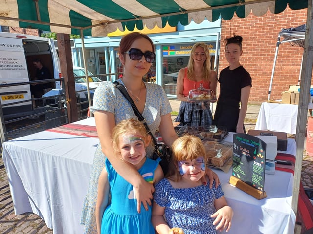Beth Denton, Ruby-Mae Smith and Eliza Fothergill enjoyed some tasty treats from the Advocate Arms stall. Image: Dianne Tuckett