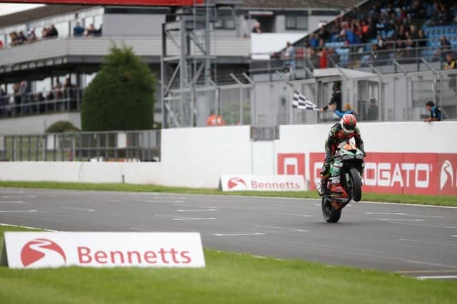Sam Laffins taking the chequered flag. Pic: Dave Yeomans.
