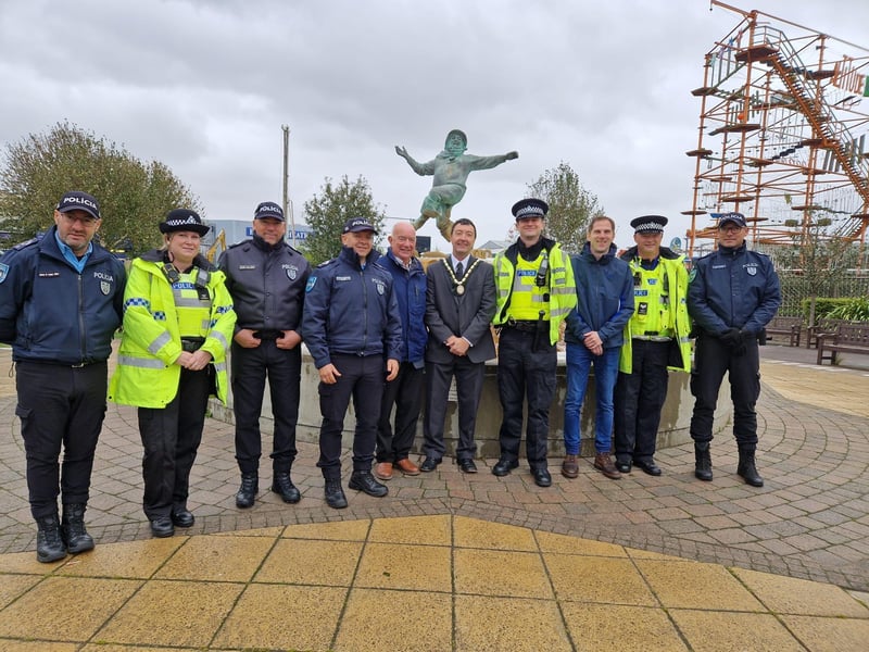 Deputy Mayor Coun Jimmy Brookes (centre) welcomes the Portugese police officers to Skegness.