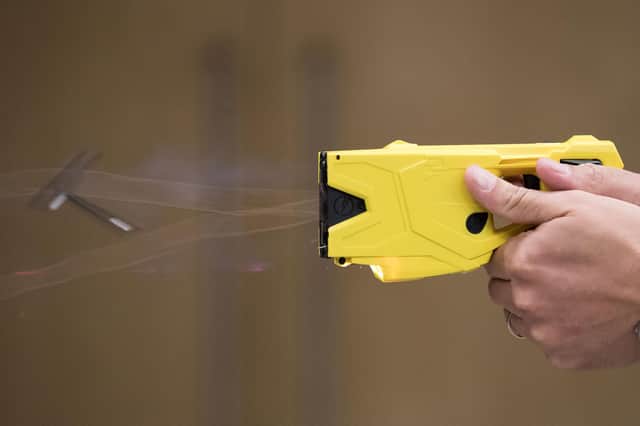 Police Sgt Ivan Merc from the West Midlands Fire Arms Unit demonstrates how to use the new X2 taser which is being rolled out in the West Midlands to replace the current X26 model.