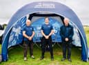 The team pictured with their paramotors.