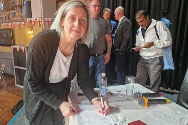 Julienne Bunce of the North Parade Hotel signing to become involved with the new bowling association.