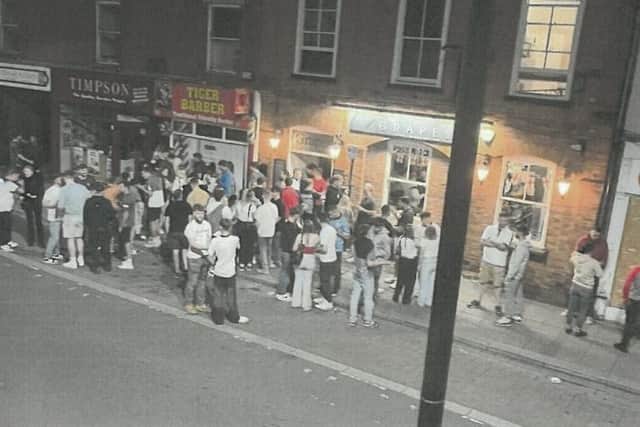 A large crowd outside The Grapes pub, Southgate, Sleaford. From Lincolnshire Police's submission to North Kesteven District Council, asking for the pub's licence to be reviewed. (Approved for use by all partners)