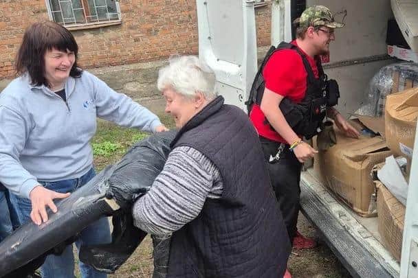 Ian and friends pictured unloading his van full of supplies for struggling families in Ukraine.
