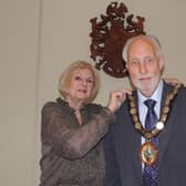 Outgoing chairman of NKDC, Coun Lucille Hagues, passes the chain of office to new chairman Coun Mike Clarke.