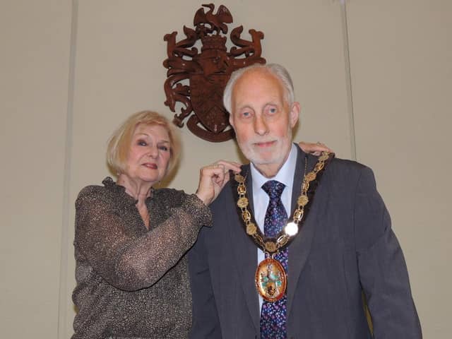 Outgoing chairman of NKDC, Coun Lucille Hagues, passes the chain of office to new chairman Coun Mike Clarke.