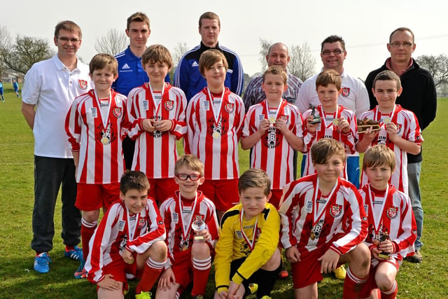 Horncastle Town's Under-10s celebrating the end of their latest season with their annual awards. Striker Louis Robinson picked up the Golden Boot award after scoring 26 goals (31 unofficially). Goal of the Season was given to Callum Burgess with a chipped effort from 25-yards out. Anthony Clarkson was awarded Supporter’s Player of the Year and the award for Commitment and Effort was given to Joshua Baxter. All the under-10 players were also presented with a medal after their last game of the season.