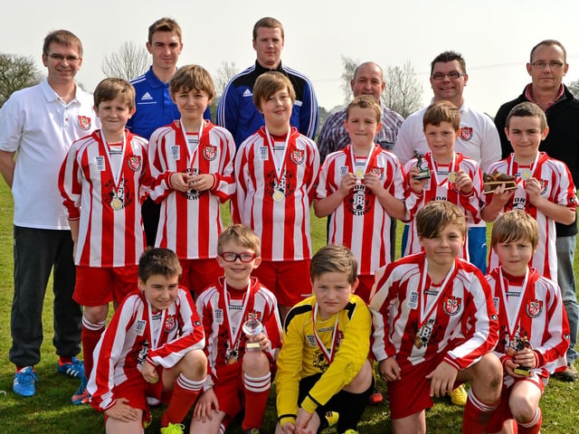 Horncastle Town's Under-10s celebrating the end of their latest season with their annual awards. Striker Louis Robinson picked up the Golden Boot award after scoring 26 goals (31 unofficially). Goal of the Season was given to Callum Burgess with a chipped effort from 25-yards out. Anthony Clarkson was awarded Supporter’s Player of the Year and the award for Commitment and Effort was given to Joshua Baxter. All the under-10 players were also presented with a medal after their last game of the season.