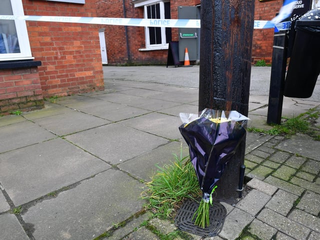 Floral tributes have begun to be laid on Union Street, Market Rasen. Photo: David Dawson