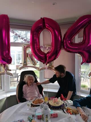 Bea Rapley celebrating her 104th birthday with Tyler Brown