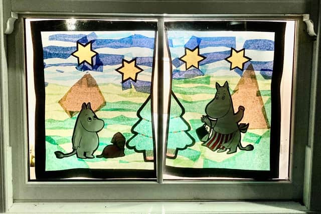 Moomins in the window of 31 St Lawrence Street.