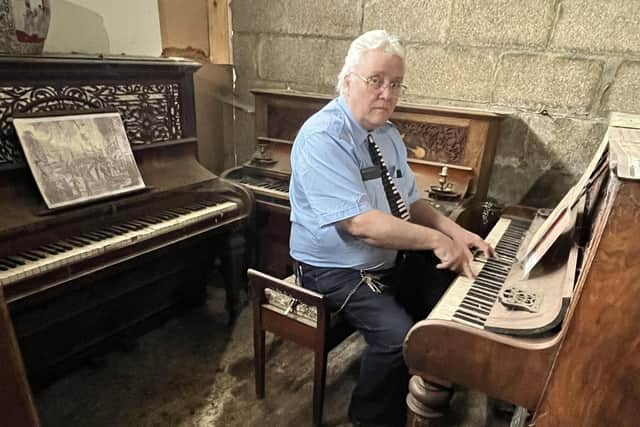 Bill with one of his pianos.