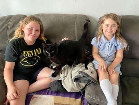 Reunited - Sooty with Hollie, 11, and younger sister Sarah, five.