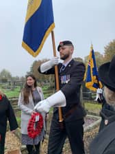 Standard bearer Chris Lake who laid the wreath  Wainfleet Royal British Legion.