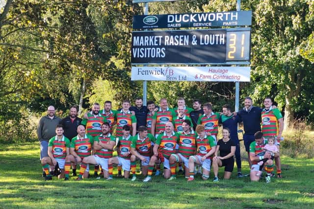 Market Rasen & Louth's players celebrate after their win.