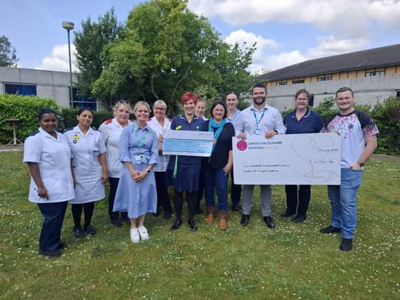 Leanne and Lewis Morgan present donations to staff from Bostonian Ward, ULH Charity and Macmillan Nurses.