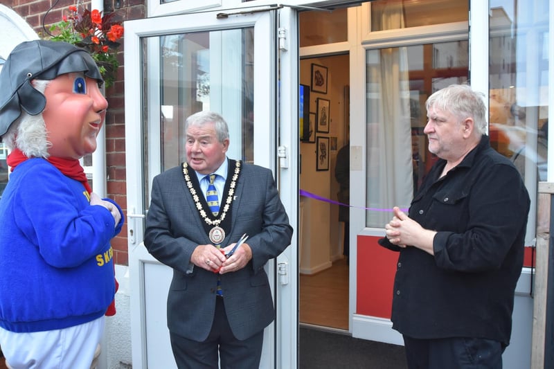 Mayor of Skegness Coun Pete Barry opening the gallery with the Jolly Fisherman and resident artist Steve Gould.