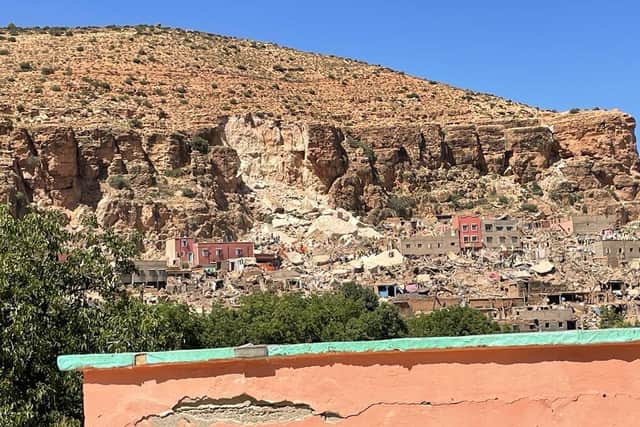 Ben Clarke took this shot of a landslide above a village, caused by the earthquake.