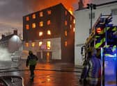 Firefighters on scene at the height of the blaze in the old warehouse on London Road, Boston. Photo: Matt King