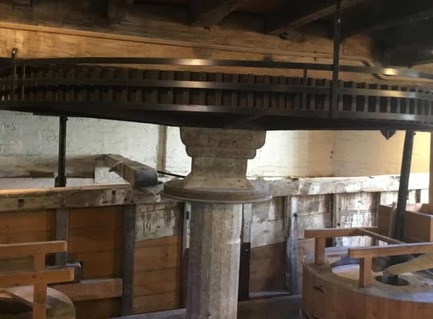 Cogglesford Mill is grinding flour for the community grocery store, supplied by a local grain merchant.