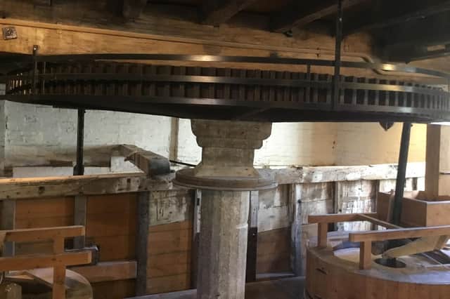 Cogglesford Mill is grinding flour for the community grocery store, supplied by a local grain merchant.