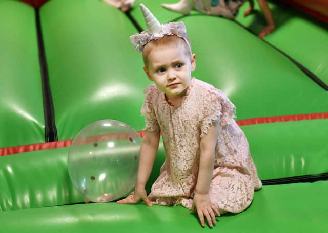 Unicorn princess Lily on the bouncy castle.