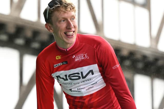 NSN Cyling Team's British rider Lewis Askey wearing the leaders jersey (Photo by Oli SCARFF / AFP via Getty Images)