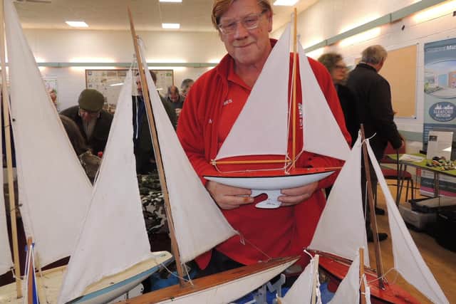 James King of Sleaford and District Model Railway Club with his son's collection of vintage model yachts.