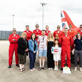 Sofia with her parents and her winning poster, alongside CDS, Lincolnshire County Council and the RAF Red Arrows.