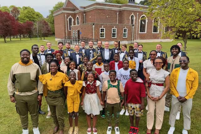 The Watoto Childrens Choir with RAF College Cranwell musicians outside St Michael and All Angels Church, at RAF Cranwell. Photo supplied