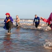 Brave Carol Frisby emerges from the sea after a previous Big Dip event in Mablethorpe on New Year's Day.