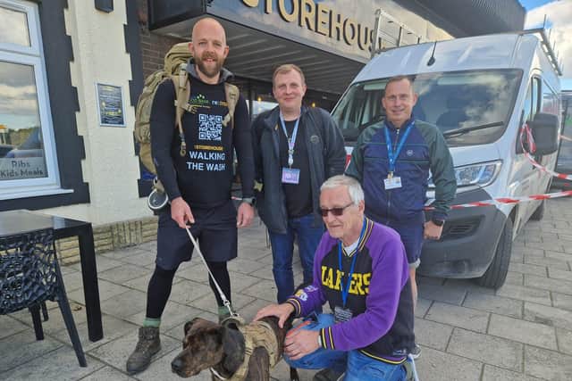 Tim Jones and Monty the dog saying farewell to the team at The Storehouse in Skegness before setting off on his 200-mile walk.