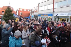 Crowds gather for the Christingle service and lights switch on in Riverside Precinct.