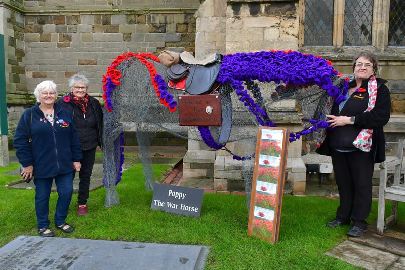 Proud of the display are (from left) Ann Lincoln of RBL, Doreen Wilson and Rachel Burnett of Knitting Nanas