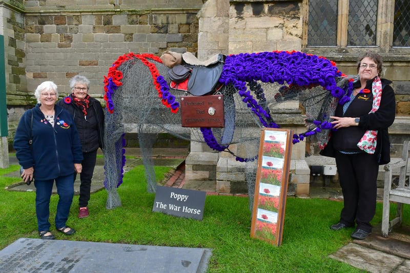 Proud of the display are (from left)  Ann Lincoln of RBL, Doreen Wilson and Rachel Burnett of Knitting Nanas